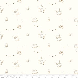 May include: White fabric with a repeating pattern of gold crowns and dots. The crowns are in various sizes and orientations.