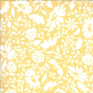 May include: Yellow fabric with a white floral pattern. The design features various flowers, leaves, and small floral clusters. The flowers are in different sizes and shapes, creating a dense, all-over pattern. The fabric has a soft, matte finish.