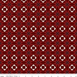 May include: A repeating geometric pattern fabric with a red background, white squares, and blue accents. The pattern is made up of squares and triangles.