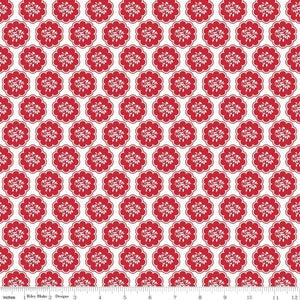May include: Red and white floral pattern fabric with a repeating design of stylised flowers in a scalloped circle. The fabric is on a white background.