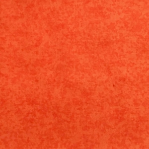 Op de afbeelding: Een effen oranje textuur achtergrond met een gespikkeld patroon.