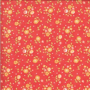 Puede incluir: Tela roja con estampado de lunares blancos y un pequeño estampado floral en amarillo y rosa.