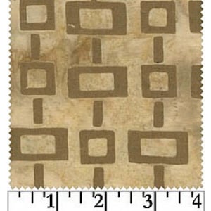 May include: Beige fabric with a repeating pattern of brown squares and rectangles. The fabric is measured with a ruler in inches.