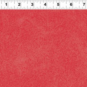 May include: Red textured fabric with a subtle speckled pattern.