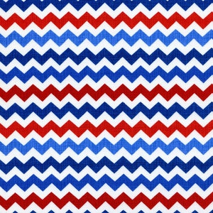 May include: Red, white and blue chevron pattern fabric. The fabric has a textured, woven look.