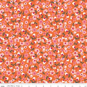 May include: A bright orange fabric with a repeating pattern of pink and white flowers. The flowers are scattered randomly across the fabric and have a simple, modern design.