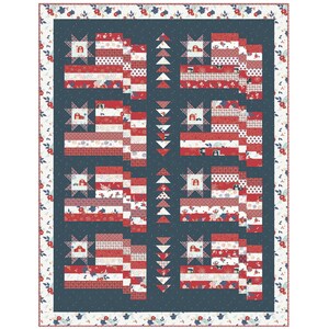 May include: A quilt with a blue background and red, white and blue stars and stripes. The quilt is made up of smaller squares, each with a different pattern. The quilt is framed with a white border with red and blue flowers.
