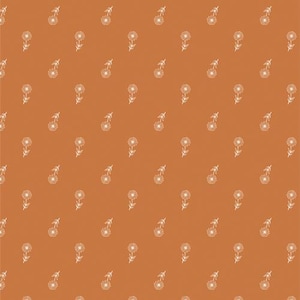 May include: An all-over pattern featuring small white floral designs on a warm, orange-brown background. The flowers have a simple, stylized appearance, with a central circular bloom and delicate stems and leaves. The pattern is evenly spaced.