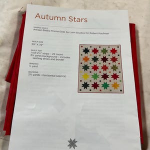 May include: A sample quilt pattern titled "Autumn Stars" with a colorful star design. The pattern includes quilt size dimensions of 59" x 72". The text also lists fabric requirements for the quilt top, binding, and backing.