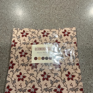 May include: A square stack of fabric squares featuring a beige background with a repeating pattern of dark red flowers and brown vines. A central label reads RICHMOND SEEDS, Barbara Brackman, moda, with five small circular color swatches below.