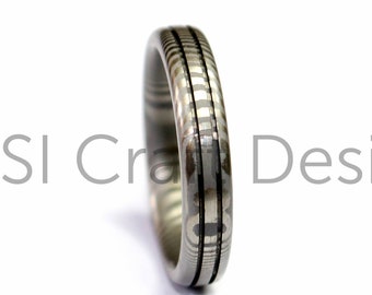 Damascus ring withtwisted pattern & two empty grooves. Custom wedding band handmade to order from Scotland UK