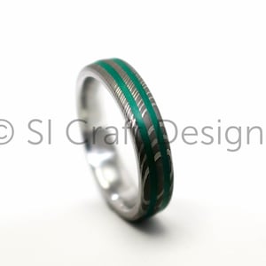 Damascus ring with painted Emerald green grooves. Custom wedding band handmade to order from Scotland UK