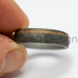 Stainless Damascus Steel Ring with SMO Gold, off-centre 18ct gold inlay, hammered and sandblasted finish. handcrafted in Scotland,UK,ethical