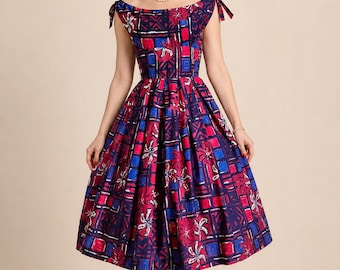 Vestido original de Alfred Shaheen de los años 50 con tirantes anudados al hombro y estampado floral y geométrico.