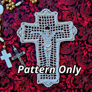 May include: A crochet pattern for a white crocheted cross with a figure of Jesus Christ in the center. The pattern is displayed on a red and black floral fabric background. The text "Pattern Only" is printed on the image.