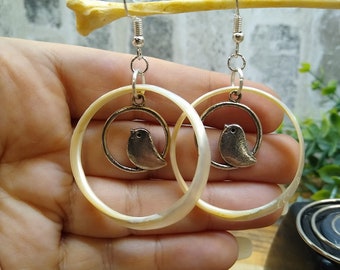 Shell and bird drop earrings