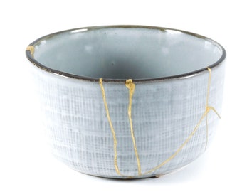 kintsugi, Japanese gold restoration bowl, gray wabi sabi bowl with relief decoration, contemporary ceramic restored in real gold