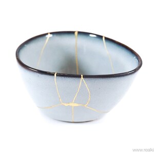 Kintsugi, triangular bowl restored with real 22K gold, contemporary ceramic repaired with the Kintsukuroi technique of resilience