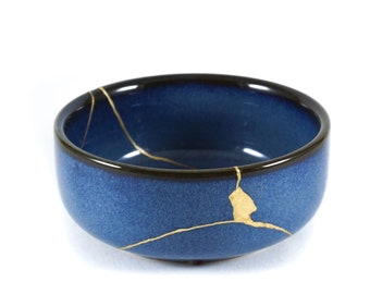 Kintsugi bowl with real gold finish. Contemporary blue ceramic repaired with the authentic Japanese technique of restoration with gold.