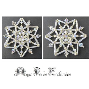 May include: Two silver snowflake ornaments with iridescent crystals. The snowflakes are made of beads and wire.