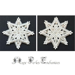 May include: Two white beaded star ornaments with a snowflake design, displayed on a black background. The stars are embellished with small white beads and larger, iridescent beads. The image includes the text "Aux Perles Enchantées" in an elegant script.