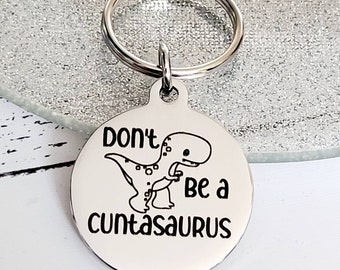 Don't be a Cuntasaurus. Profanity keyring.