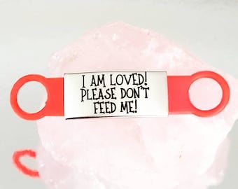 Please don't feed me! silicone and Steel pet ID tags, 2 sizes and 4 colours to choose from. Laser engraved. Cat tag