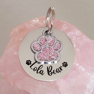 Pet tags engraved,  stainless steel available with pink, blue,green, yellow, red or silver paw.