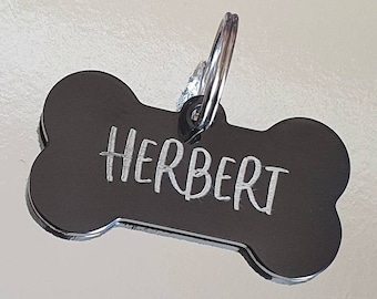 Dog ID tags, black bones with silver showing through, various fonts to choose from