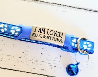 Please don't feed me! silicone and Steel pet ID tags, 2 sizes and 4 colours to choose from. Laser engraved. Cat tag