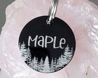 Woodland design ID tags, black disk with silver/white showing through, various fonts and sizes to choose from