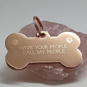 Bone shaped pet ID tag with paw design, 5 colours and 2 sizes to choose from.