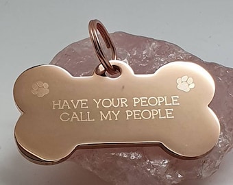 Bone shaped pet ID tag with paw design, 5 colours and 2 sizes to choose from.