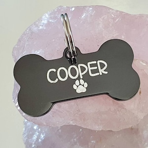 Dog ID tags, stainless steel black bones with silver showing through, various fonts to choose from
