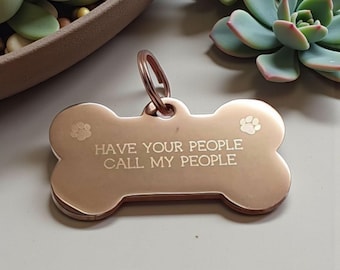 Bone shaped pet ID tag with paw design, 5 colours and 2 sizes to choose from.