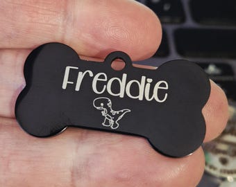 Dino themed pet ID tags,  various colours, sizes and fonts to choose from. Engraved both sides