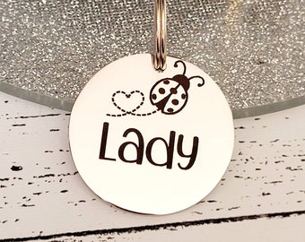 Ladybird design.  Pet ID tags laser engraved,  stainless steel available in silver, gold and rose gold