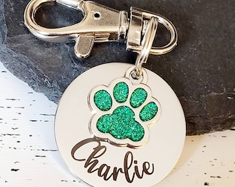 Pet tags engraved,  stainless steel available with pink, blue,green, yellow, red or silver paw.