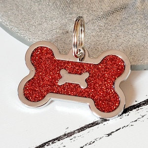 Quality coloured red sparkly bone dog ID tag, laser engraved.