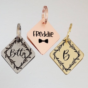 Dog ID tags, diamond shape, various fonts to choose from. Laser engraved 40mm