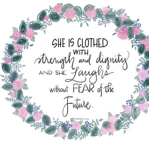May include: A floral wreath with pink and blue flowers surrounds a quote from Proverbs 31:25, "She is clothed with strength and dignity, and she laughs without fear of the future."