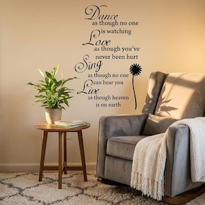 May include: A black wall decal featuring the quote: Dance as though no one is watching, Love as though you've never been hurt, Sing as though no one can hear you, Live as though heaven is on earth, accompanied by a stylized black dandelion graphic.