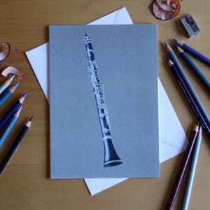 Carte de voeux pour clarinette dessinée au crayon de couleur, illustration par Steve Barker. Conçu et imprimé au Royaume-Uni