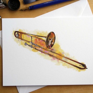 Carte de voeux pour trombone ténor, dessin à la plume et à l'encre, illustration de Steve Barker. Conçu et imprimé au Royaume-Uni