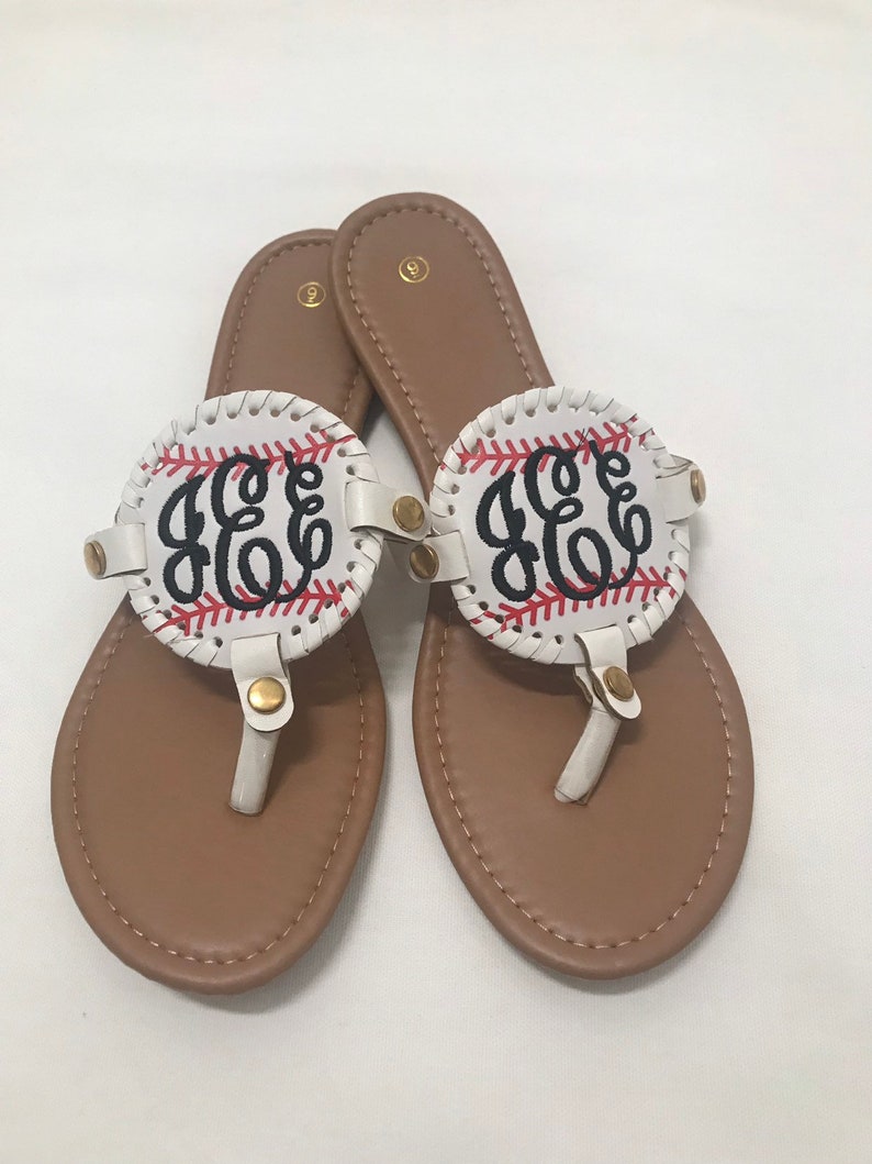flip flops with gold medallion