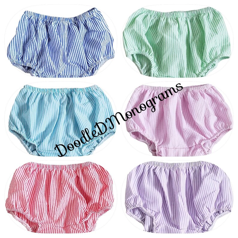 May include: Six pairs of striped baby bloomers in various colors, including blue, green, pink, and purple.  Doodle D Monograms.