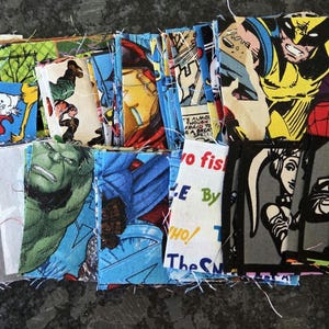 May include: A collection of fabric squares featuring comic book and cartoon characters. The squares display images of Wolverine, Hulk, Iron Man, a Stormtrooper, and characters from Dr. Seuss. The fabrics are in various colors.