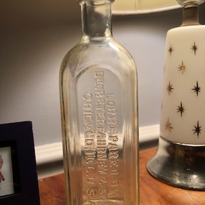 Vintage clear Glass 9 in. Apothecary Bottle Embossed Dr Peter Fahrney Reliable old time preparation for home use Chicago