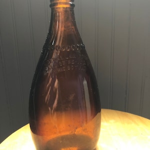 Sweet brown glass vintage  bottle with character in great condition