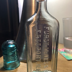 Vintage aqua Glass Apothecary Bottle Embossed Furst McNess Co Freeport Ill.
